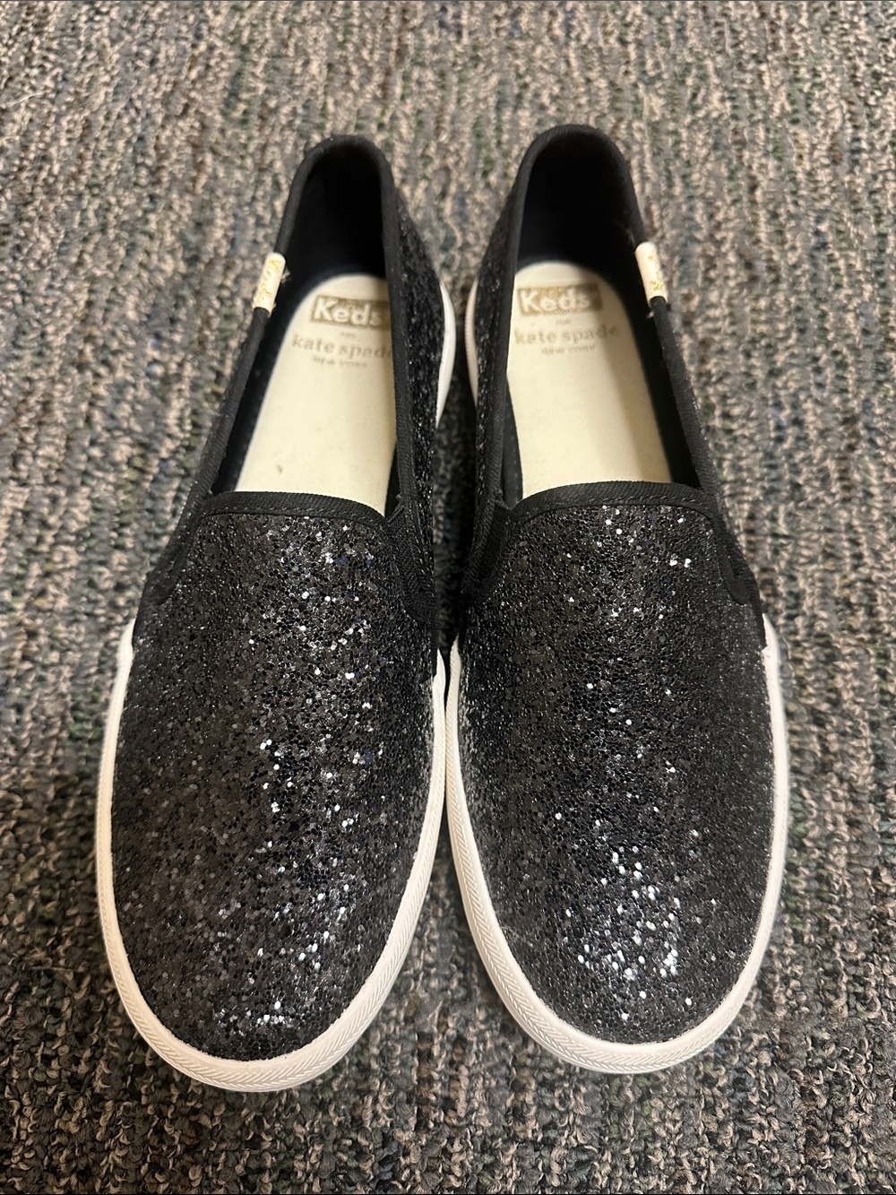 kate spade black glitter slip-on sneakers with white sole